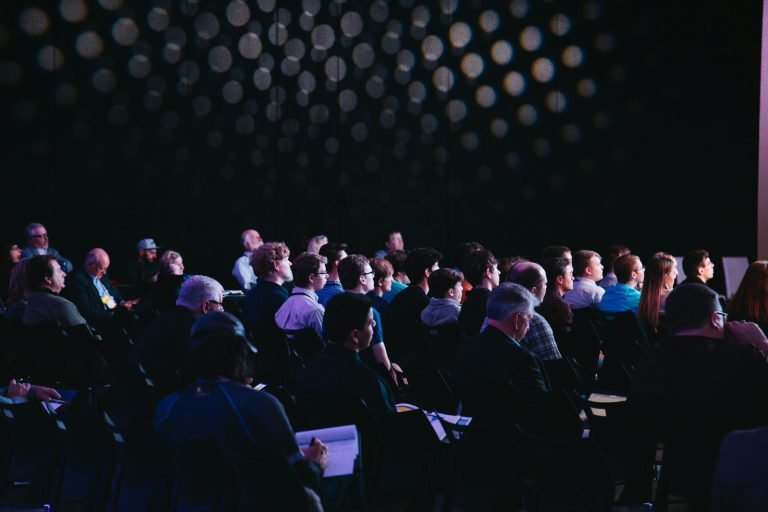 An audience seated at a conference