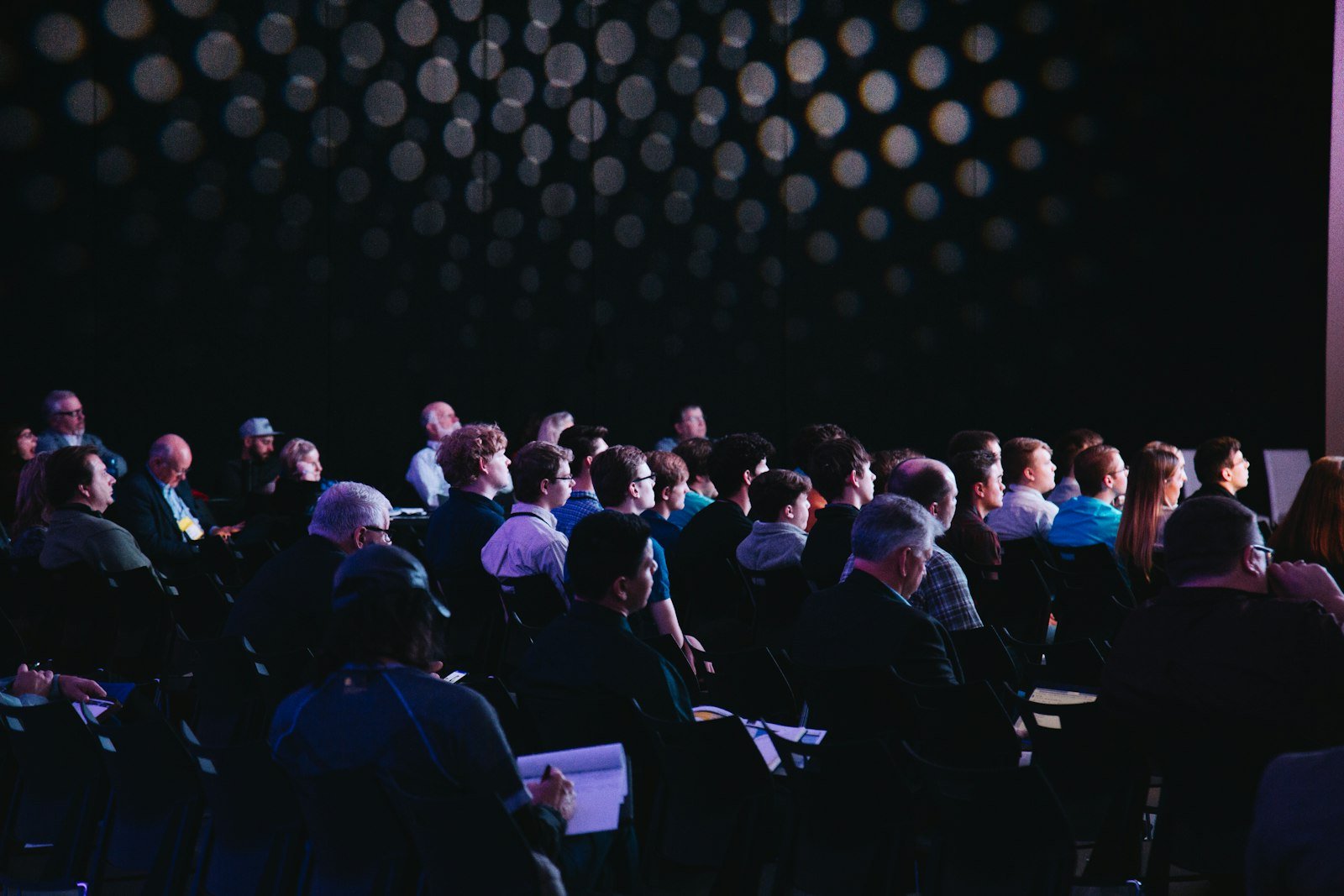 An audience seated at a conference