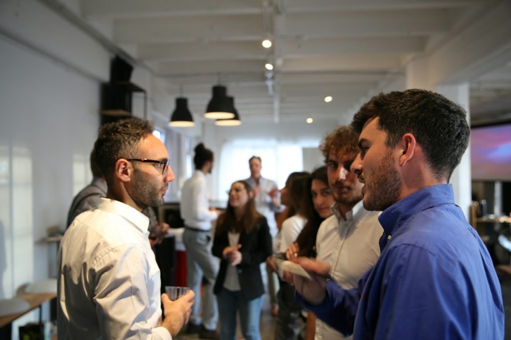 People talking at a networking event